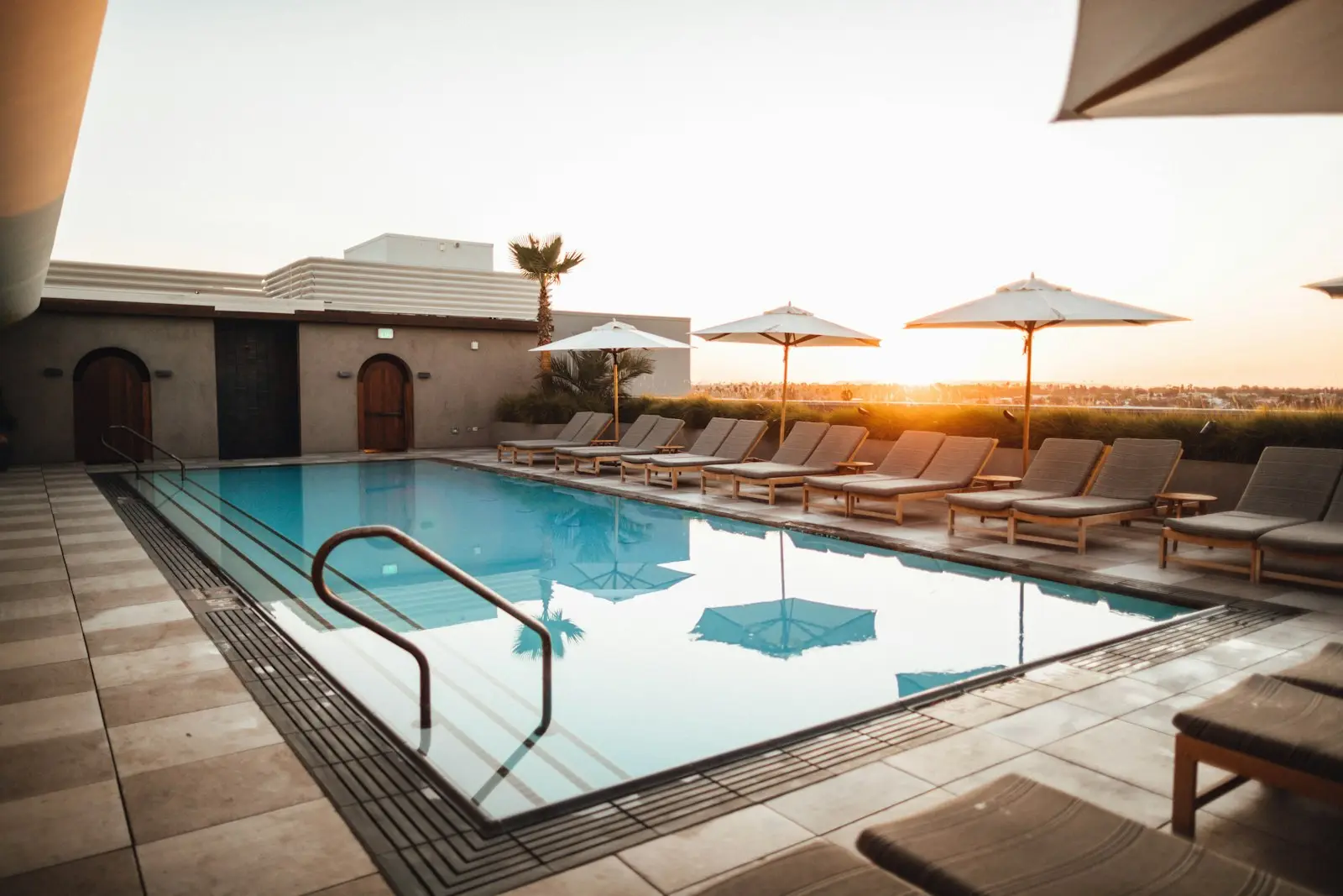 A clean, sparkling backyard pool at sunset in the Phoenix Arizona desert